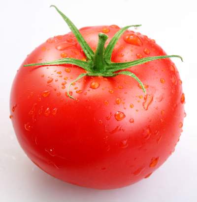 Juicy red tomato with water droplets