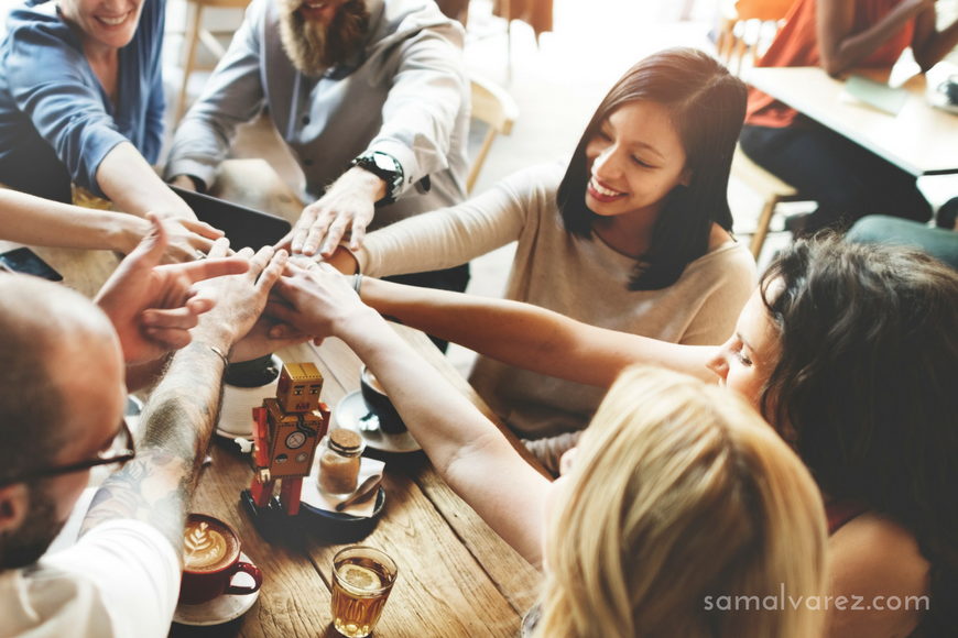 people-making-pile-of-hands