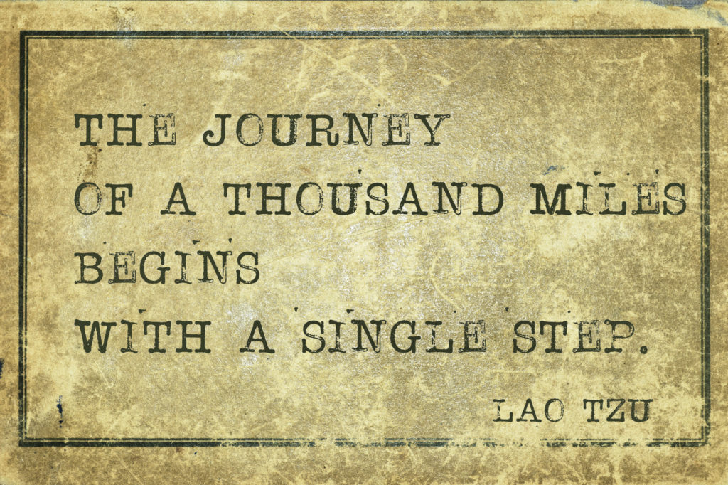 journey of a thousand miles - ancient Chinese philosopher Lao Tzu quote printed on grunge vintage cardboard